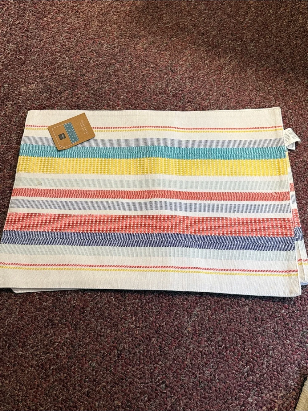 Blue Round Placemat with Multi-Color Striped Kitchen Towel
